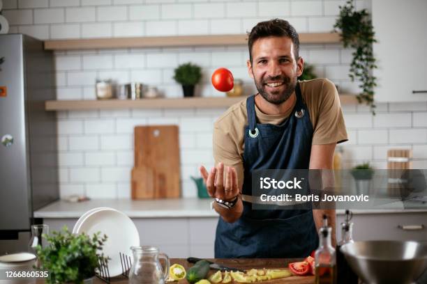 Funny Cooking. Attractive Caucasian Man In The Kitchen Stock Photo, Picture  and Royalty Free Image. Image 65857067.