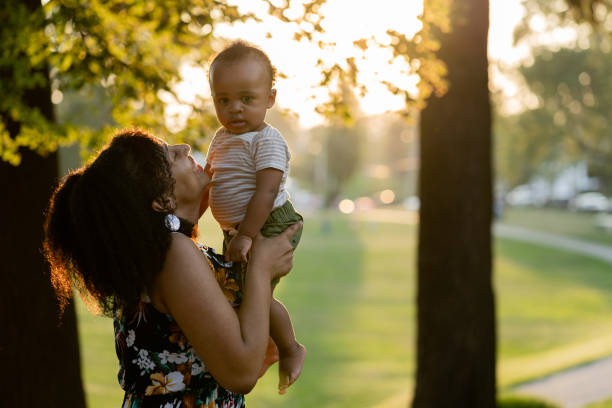 istock Black mom and son enjoying summer in the park 1266863628