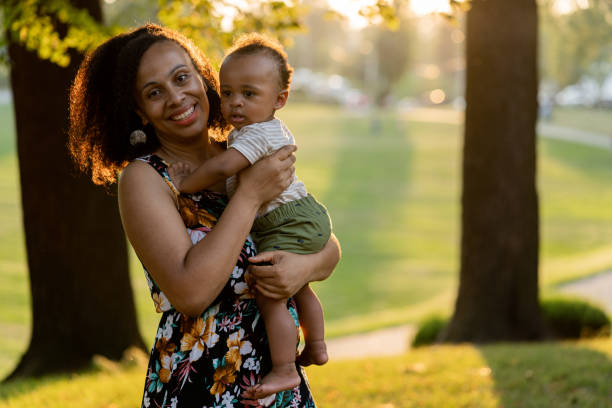 istock Black mom and son enjoying summer in the park 1266863656