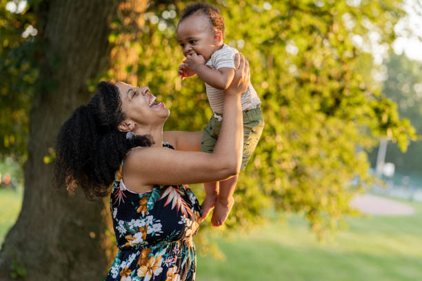istock Black mom and son enjoying summer in the park 1266863678