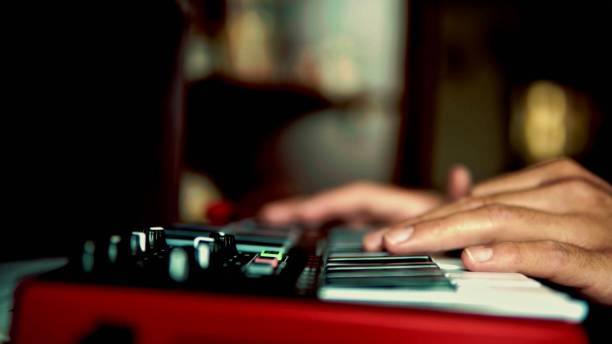 istock focus on the hand of a man who is playing synthesizer 1266867538