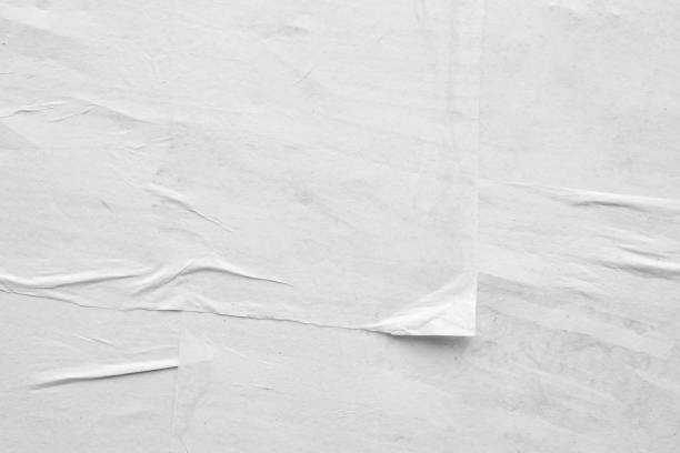 istock Blank white crumpled and creased paper poster texture background 1266868284