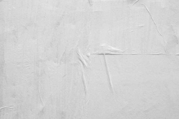 istock Blank white crumpled and creased paper poster texture background 1266868285