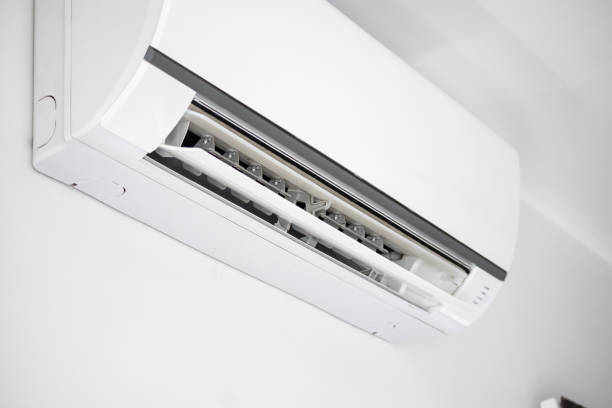 istock Air conditioner on white wall room interior background 1266868374