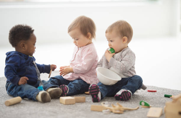istock Diverse group of babies playing together 1266869254