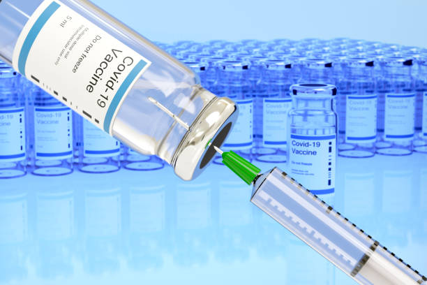 istock Covid -19 vaccine vial and injection syringe. Selective focus.. 3d illustration. 1266870743