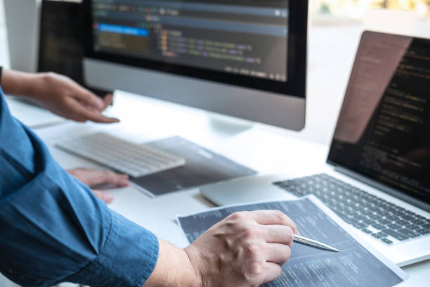 istock Team of Professional Developer programmer cooperation meeting and brainstorming and programming in website working a software and coding technology, writing codes and database 1266872310