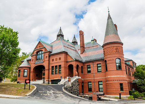 Belmont, Massachusetts, USA - August 17, 2020: Town Hall building in Belmont Massachusetts. Originally built in 1881. Located at the intersection of Concord Avenue and Pleasant Street.