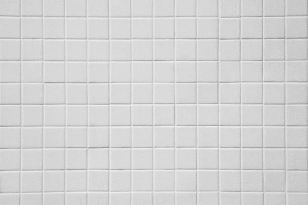 istock Pattern of White tiles on the wall texture background 1266877460