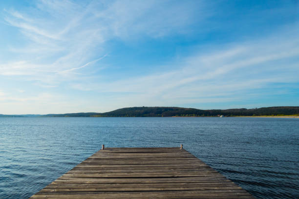 wooden pier in lake brombachsee in germany - altmühltal imagens e fotografias de stock