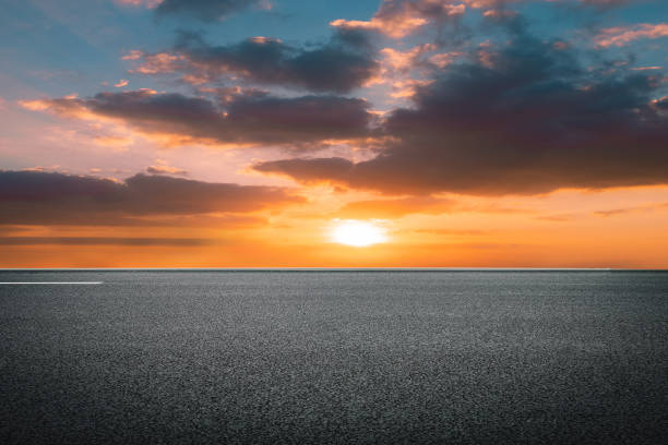 istock Evening glow, flat and wide asphalt road 1266882831