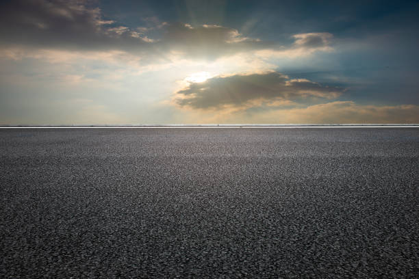 istock Evening glow, flat and wide asphalt road 1266882832