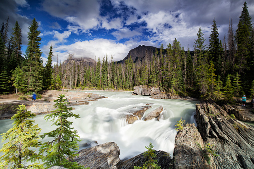 Tourists at Natural Bridge in summer in Yoho National Park, BC, Canada