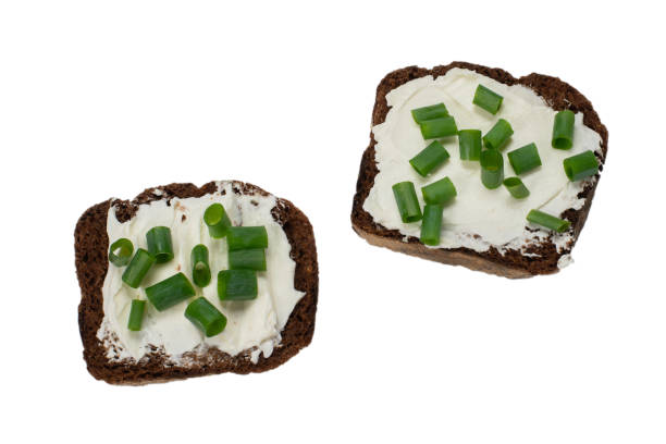 istock Brown bread and cheese isolated on white background. 1266896576