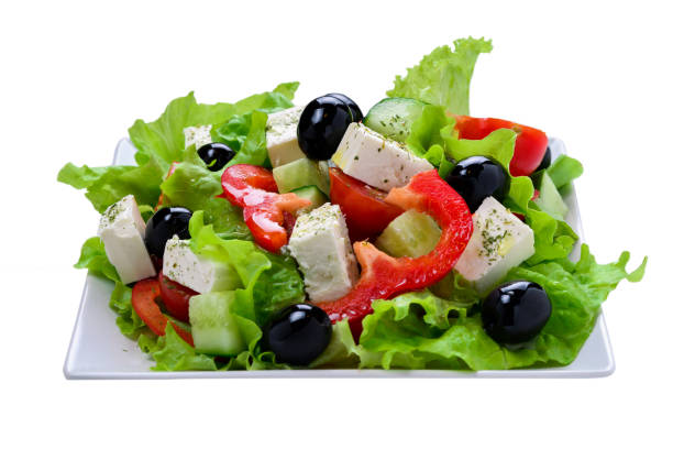 istock Greek salad on a white background. Space for text or design. 1266896601