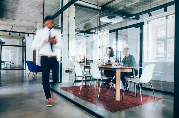 istock Business meeting at busy corporate office. 1266897342