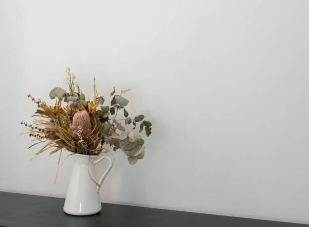 istock Dried Australian flowers in jug on bench 1266899547