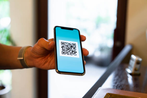istock Men who use QR codes to make contactless payments using their smartphones 1266900509