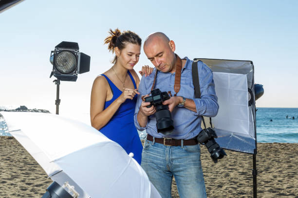istock Photographer working on sea beach 1266903305
