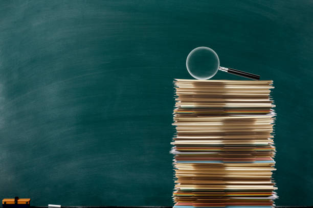 Magnifying glass with file folder