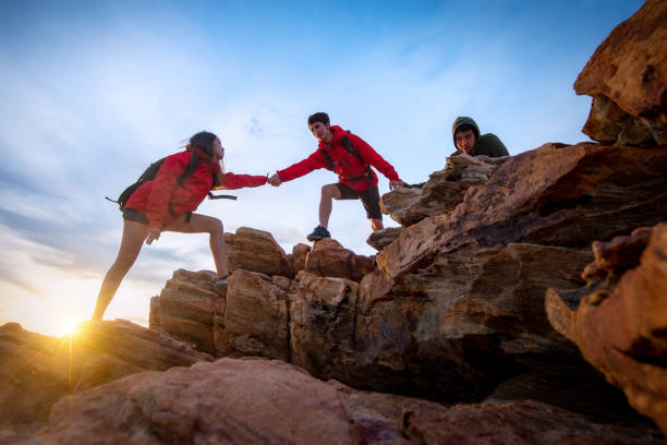 istock Hikers climbing up on the mountain. 1266907523