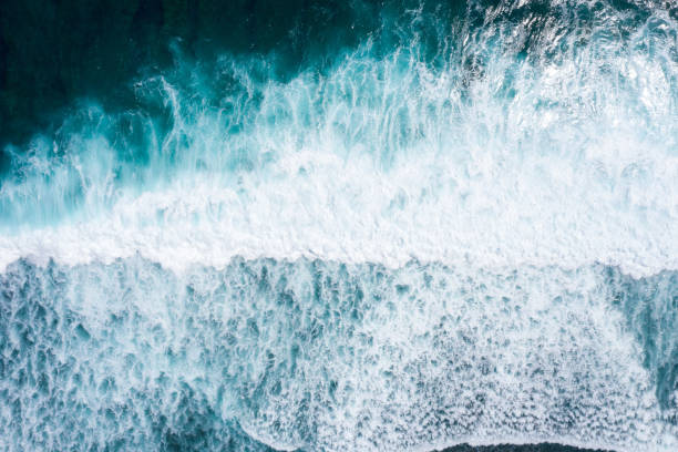 istock Aerial view to ocean waves. Blue water background 1266907630