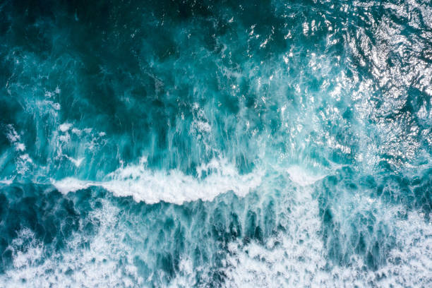 istock Aerial view to ocean waves. Blue water background 1266907644