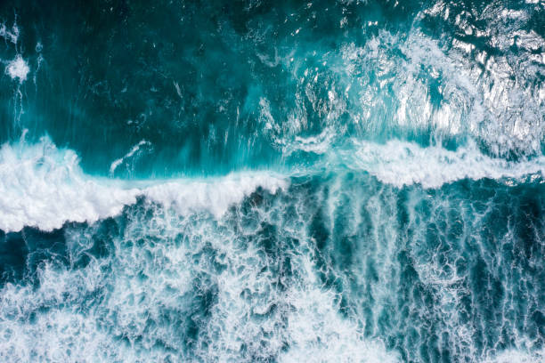 istock Aerial view to ocean waves. Blue water background 1266907656