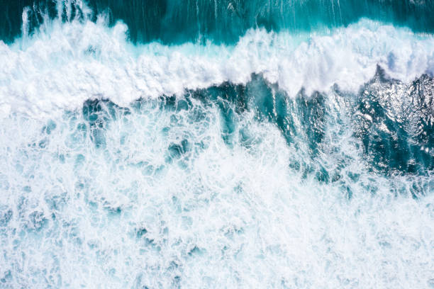 istock Aerial view to ocean waves. Blue water background 1266907661