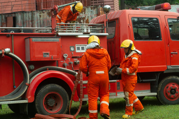 istock The fireman is preparing to put out the fire at the fire engine. Because the fire was burning in the building. 1266909474