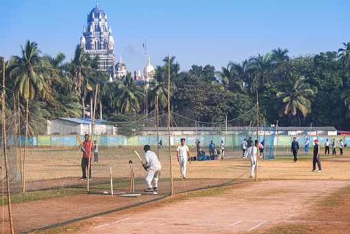 01/08/2020 Mumbai, India. Young people playing cricket on Oval Maidan, Churchgate, Mumbai, Maharashtra. Cricket is an important part of the culture of india