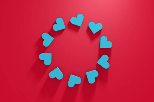 istock Blue Heart Shapes on Red Background 1266919176