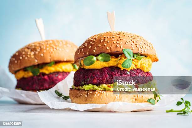 Vegan Beetroot Burger With Sweet Potato Sauce And Guacamole Plant Based Diet Concept Stock Photo - Download Image Now