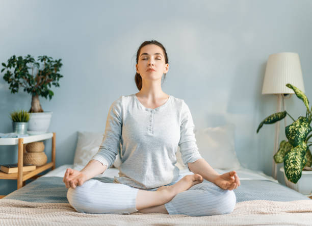 istock woman enjoying sunny morning and practicing meditation 1266921531