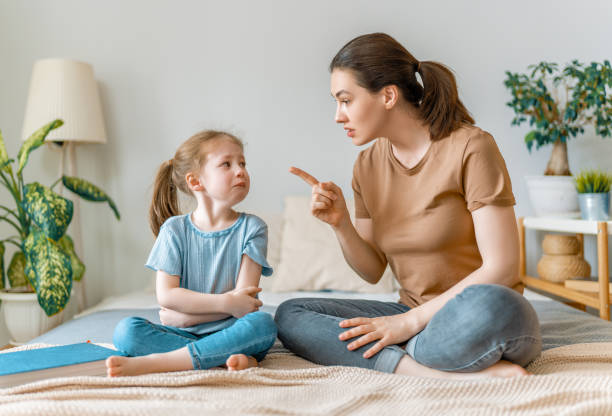 Happy loving family mother is scolding her child girl. family relationships scolding stock pictures, royalty-free photos & images