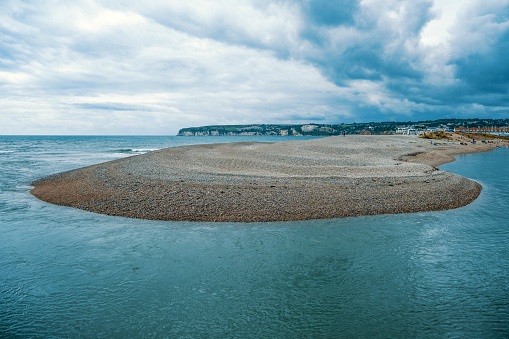 The river meets the sea by Seaton in Devon, evening photo