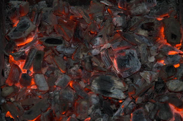 istock Burning coal background, close up of black and red burning coal 1266923316