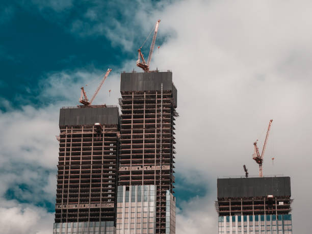 istock Construction work site and high rise building. High-rise building under construction. Reinforced concrete frame 1266928940