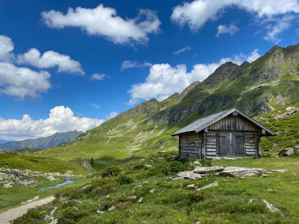 Old barn on the shore of the Lake Giglachsee in the Styrian Tauern - Austria. The place without  tourists after the coronavirus pandemic.