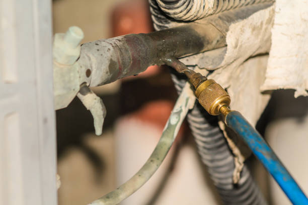istock gas is being refiling into the heavy  ac compressor of central air conditioning system 1266929717