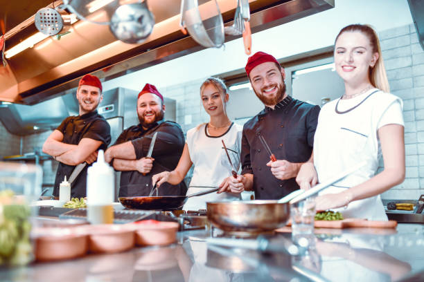 istock Modern Kitchen Team With Their Tools Of The Trade 1266929718