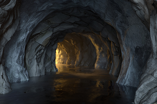 The dark rock tunnel with light illuminated in the end, 3d rendering. Computer digital drawing.