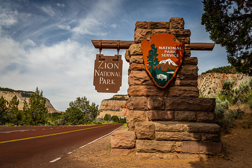 Zion National Park, Utah, USA - June 13, 2020: The official National Park Service sign that marks the east entrance to Zion National Park in Utah