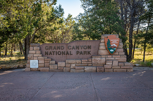 Grand Canyon Village, Arizona, USA - June 12, 2020: The official National Park Service sign that marks the southern entrance to Grand Canyon National Park in Arizona
