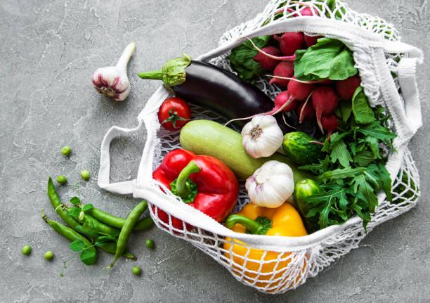 istock Fresh vegetables and fruits in eco  string bag 1266936337