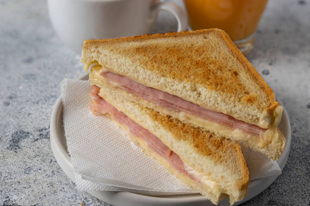 Ham and cheese sandwich sandwich cut in half.Popular packed lunch food Ham and cheese sandwich sandwich cut in half.Popular packed lunch food ham and cheese sandwich stock pictures, royalty-free photos & images