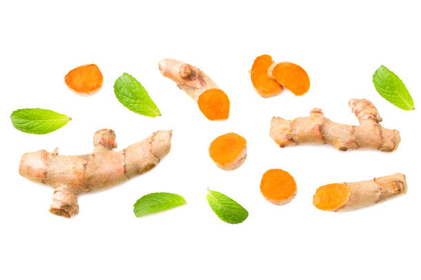 istock Turmeric root with turmeric slices isolated on white background. Top view. 1266936470