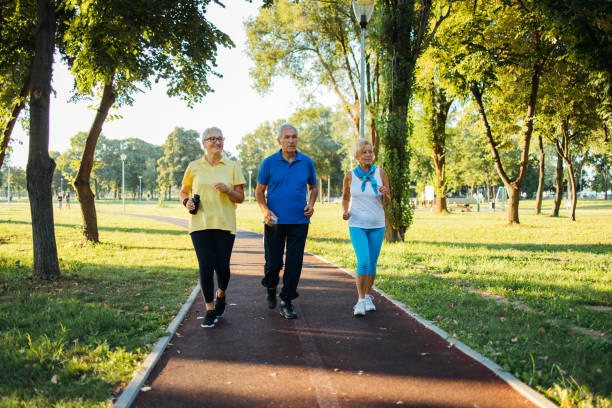 istock Seniors jogging in park 1266937840
