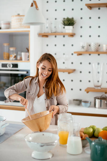 istock Young women in kitchen stock photo 1266938997