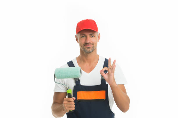 istock Able to work quickly and accurately. Painter decorator show ok sign isolated on white. Work man hold paint roller. Painting work. Good manual skills. Skilful in decorating work. Renewal and repair 1266939762